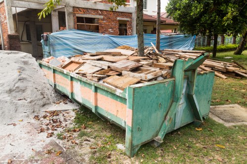 People disposing of old furniture in Brent Cross